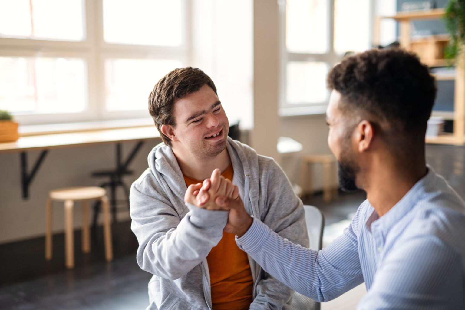 Support coordinator celebrating with a participant